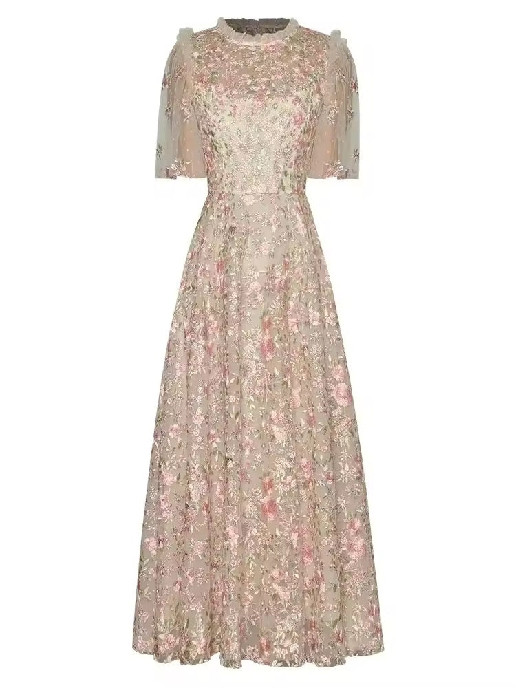 
                  
                    Floral dress with sheer sleeves on a white background
                  
                